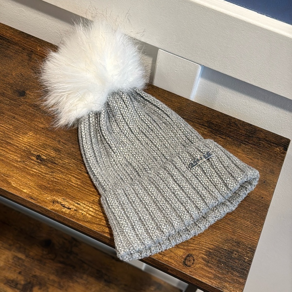 Lipsy London cable knit hat in silver and gray with faux fur pom Pom.